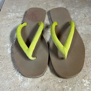 Rothy’s lime green flip flops